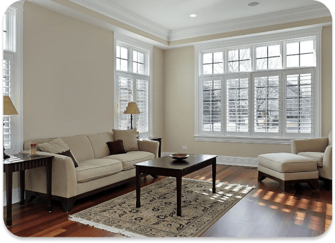 A living room with newly painted walls and neutral furnishings